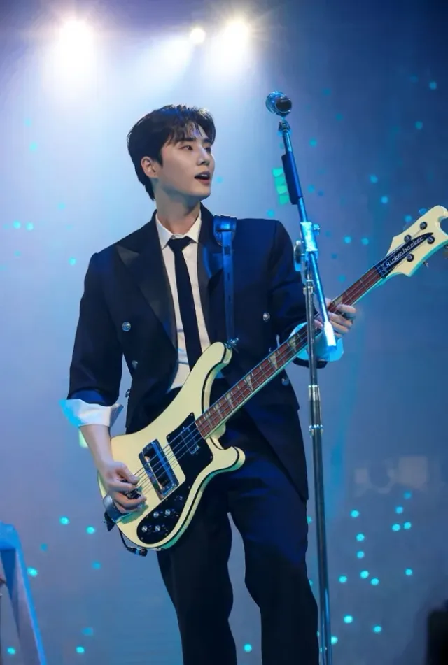 DAY6's Young K performing on stage during a live performance while promoting YOUNGEST.